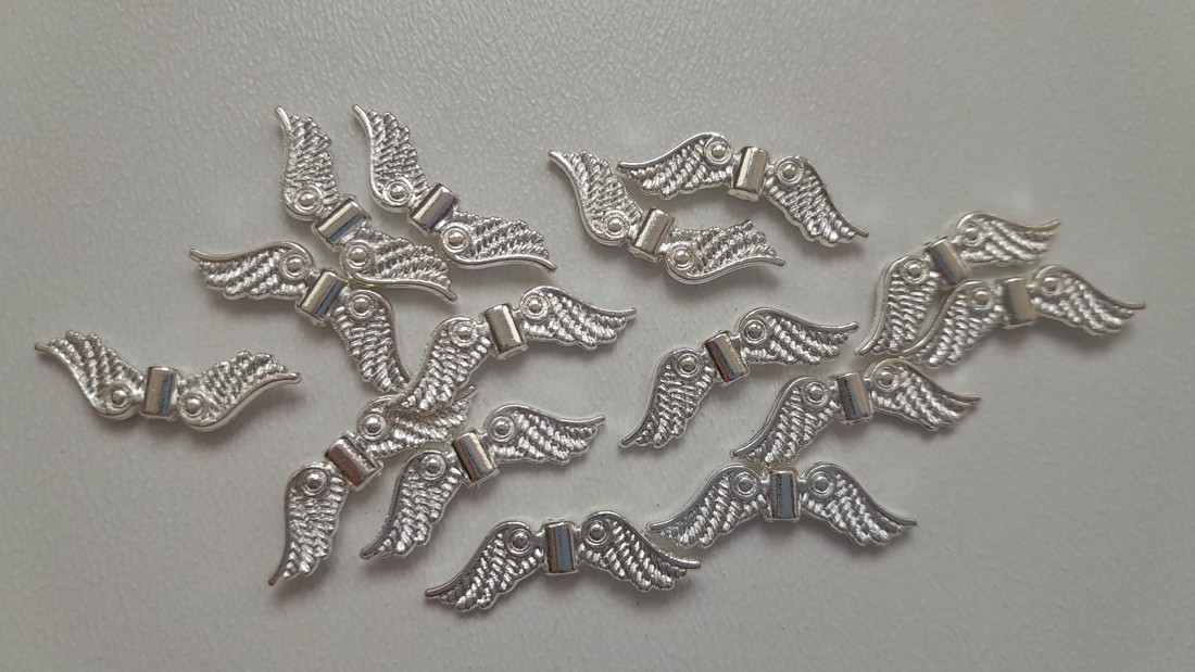 Aripă de înger din metal - 22x6mm - 10 bucăți / pachet - culoare argintie - - Artynos.ro Aripă de înger din metal - 22x6mm - 10 bucăți / pachet - culoare argintie - - Artynos.ro